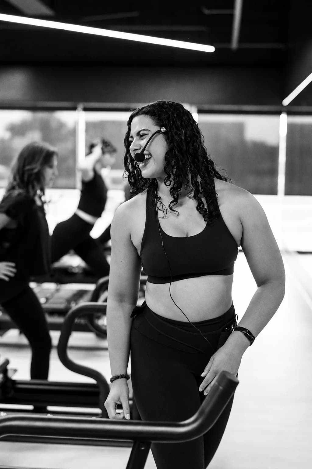 Clients and instructors exercising on Megaformers during a Resistance class